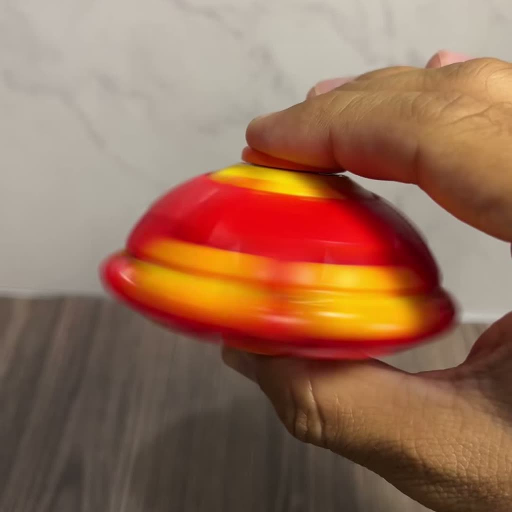 Pelota Spinner achatada girando como trompo